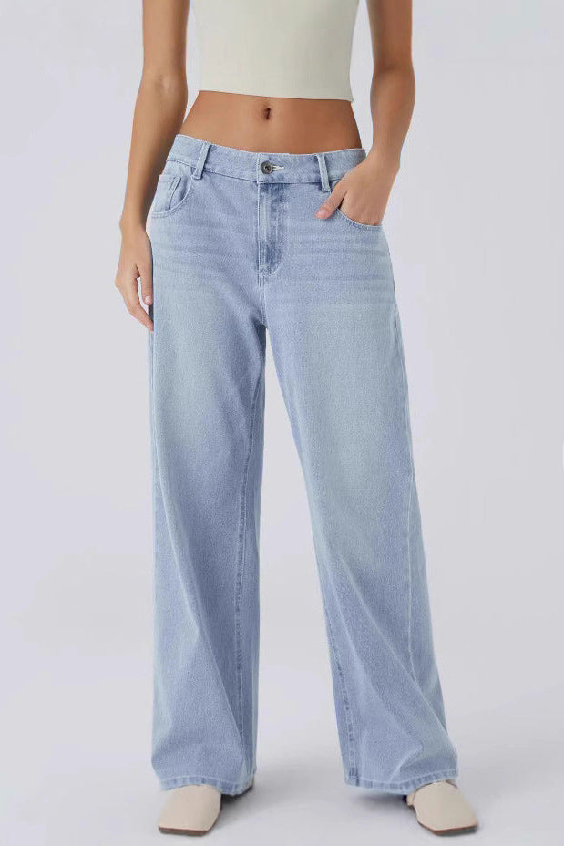 Light blue jeans worn by a person on a white background 
