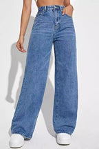 Person wearing blue jeans on a white background