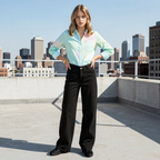 Woman standing on a rooftop with a city skyline in the background