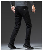 Jeanity Denim – Men's Slim Fit Straight Leg Denim Jeans – JeanityDenimMensSlimFitStraightLegDenimJeansPersonwearingblackcamouflagepantsonagraybackground20260420115125jpg