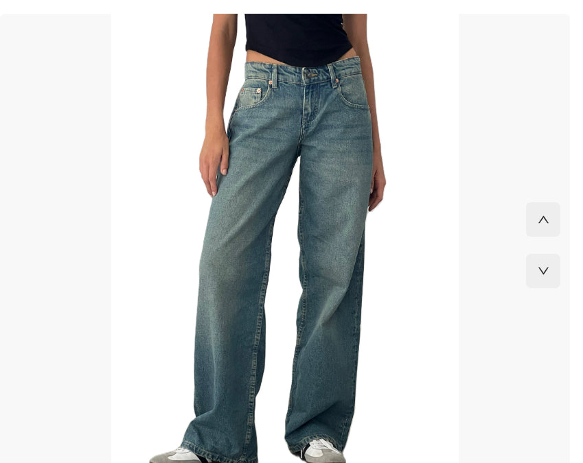 Person wearing blue jeans on a white background