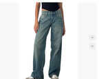 Person wearing blue jeans on a white background