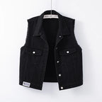 Black denim vest on a white background