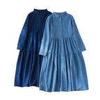 Two blue dresses on a light background 